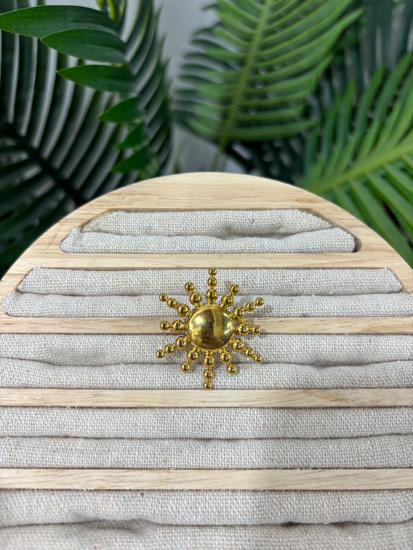 Broche sol